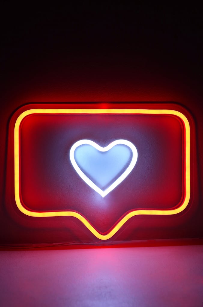 Neon sign red and white like Instagram heart in the decor. Trendy style. Valentine day.